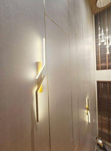 a white cabinet with a light on it in a room at Villa Cassandra Atasha Private Resort - Celestine in Cuayan