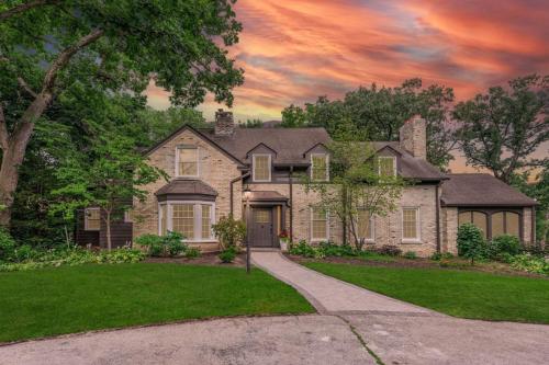 a large house with a driveway in front of it at Chic Modern Glam in Rockford