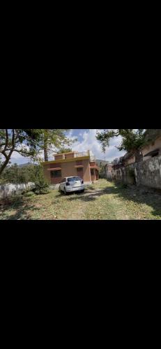 a car parked in front of a house at Sn homes in Dehradun