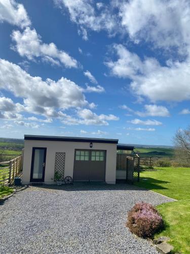 a small house with a gravel driveway at Meadow View in Haverfordwest