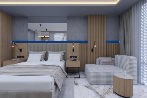 a hotel room with two beds and a couch at Almaris Resort in Alanya