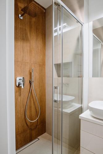 a bathroom with a shower and a sink at Apartament Różany 2 in Busko-Zdrój