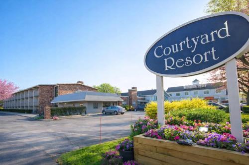 a sign for a court yard resort in a parking lot at Courtyard Resort in Hyannis