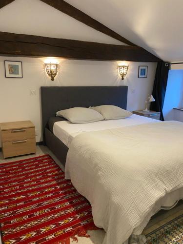 Rúm í herbergi á Appartement duplex