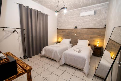 a room with two beds in a room at Ottoka in Kos