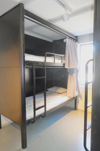 a group of bunk beds in a room at Kville Hostel in Gothenburg