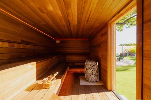 an indoor sauna with wood paneling and a window at Webber East in Austin