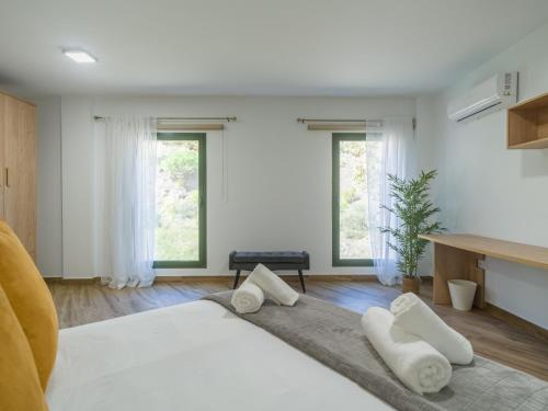 a bedroom with a large white bed with two pillows at Aguadulce Agaete 1B in Agaete