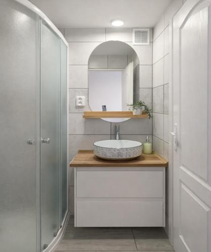 a bathroom with a sink and a shower at Ubytování Ledňáček in Lednice