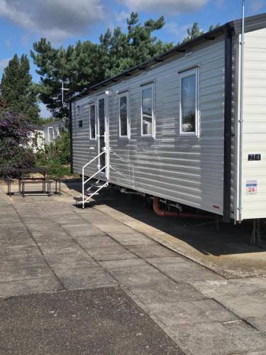 a silver trailer parked in a parking lot at D&A Southview getaway in Skegness