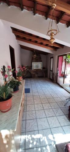a living room with a tile floor and a ceiling at Apartment near the Lake -Pogradec in Pogradec