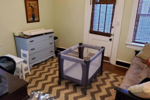 a room with a dresser and a dresser with a mirror at The Red Rooster Bungalow in Asheville