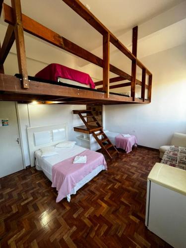 a bedroom with a bunk bed and a loft at DM Thermas Hotel Iraí in Iraí