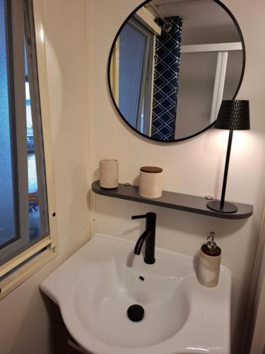 a bathroom with a sink and a mirror at Villa Petra 1 in Vodice