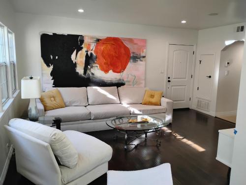 a living room with a couch and a table at Cozy Suite near Universal Studios in Los Angeles