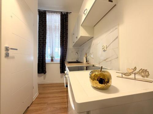 a kitchen with a sink and a bowl on a counter at Chińczyk in Inowrocław