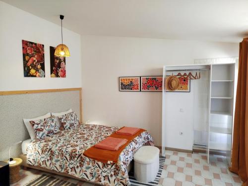 a bedroom with a bed in a room at Cosy Loft by l'Arche de Jo in Santana