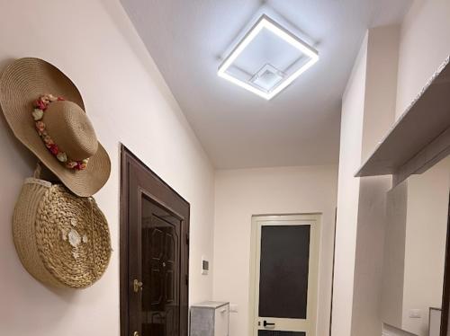 a room with a hat on the wall and a door at Bogdani Apartment in Golem
