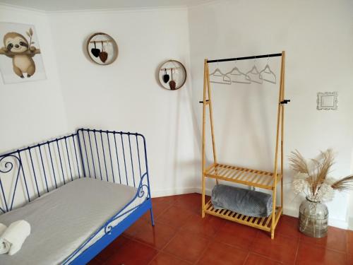 a bedroom with a bed and a mirror at Casa dos Marias in Elvas