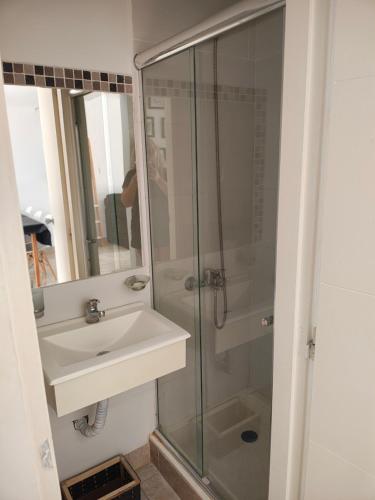 a bathroom with a sink and a shower at Amarras pinamar in Pinamar