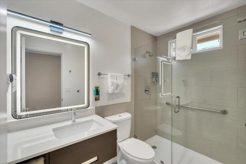 a bathroom with a toilet and a sink and a shower at Hotel 414 Anaheim in Anaheim