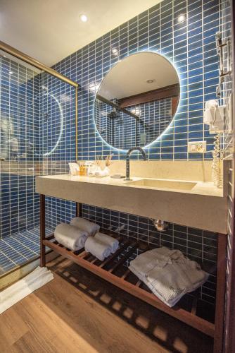 a bathroom with a sink and a mirror at Pousada Morena in Fernando de Noronha