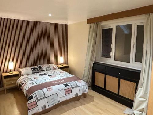 a bedroom with a bed and a window at StaxBnB in London