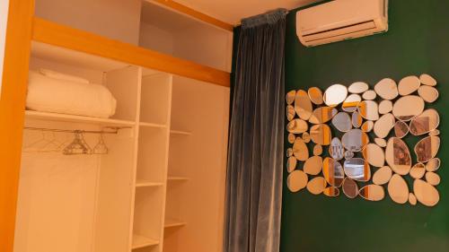 a closet with a rack of glasses on the wall at Villa Kimia Elfeige in Marrakesh