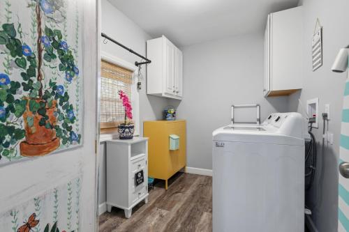 a small bathroom with a sink and a washing machine at Sailors Delight in Beaufort