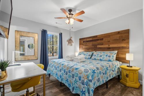 a bedroom with a bed and a ceiling fan at Sailors Delight in Beaufort