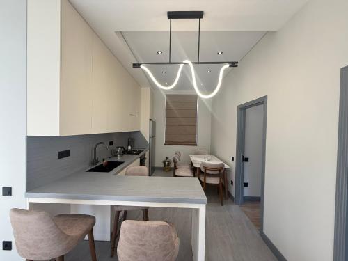 a kitchen with a table and chairs in a room at Mountain sight Villa in Sheki