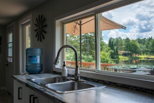 a kitchen counter with a sink and a window at Detente Namur in Namur