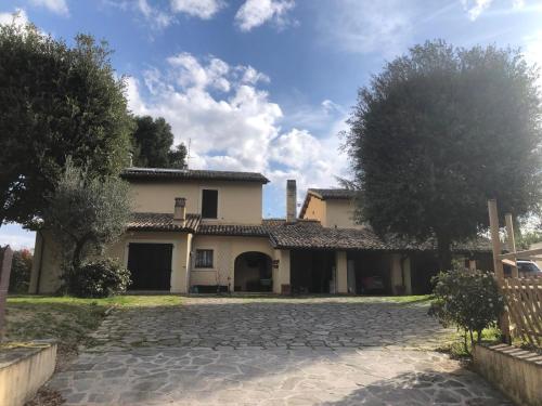 a house with a stone driveway in front of it at Via Belvedere 50 in Montefalco