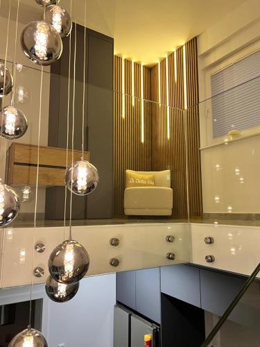 a dressing room with a mirror and a couch at Vila VivaVir with 2x E-Scooter, private Pool & Grill in Vir