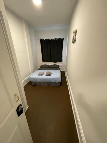 a small room with a bed in a hallway at TORONTO UNIVERSITY PRIVATE ROOM-Next to Eaton Centre in Toronto