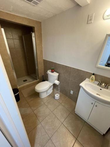 a bathroom with a toilet and a sink at TORONTO UNIVERSITY PRIVATE ROOM-Next to Eaton Centre in Toronto
