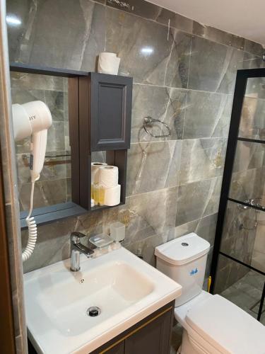 a bathroom with a sink and a toilet at MARTIAN LANDSCAPE lUXURY CAMP in Wadi Rum