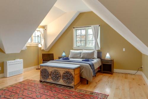 a bedroom with a bed and a window at Hike, Bike, & Explore: Vermont Family Farmhouse! in New Haven