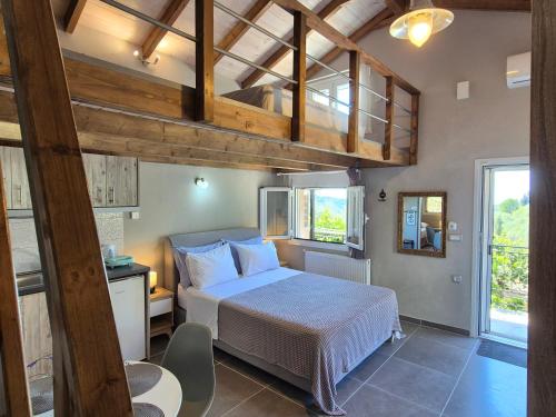 a bedroom with a bed and a loft at Sogno 1 in Parga