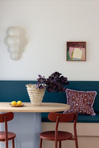 a dining room with a table and two chairs at Bon Bon Apt 5 - Tonka in Orange
