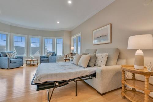 a living room with a couch and a table at The Hill Dog Friendly Panoramic Ocean Views in York