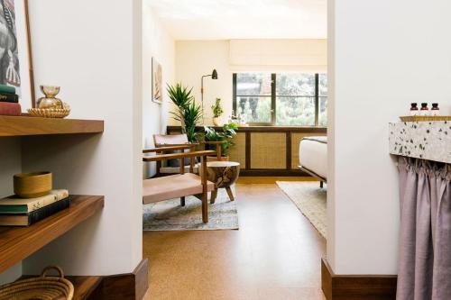 a living room with a couch and a table at Silver Lake Pool & Inn in Los Angeles