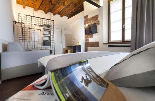 a hotel room with a bed and a bathroom at Casa Alla Lega in Arco