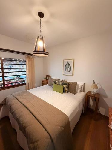 a bedroom with a large bed in a room at La Josefina Hotel Boutique in Olavarría