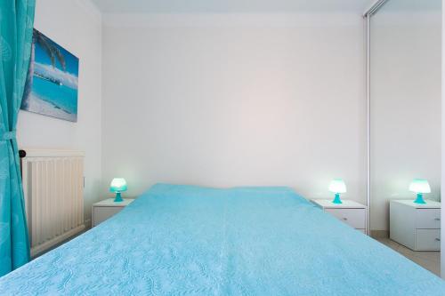 Ένα ή περισσότερα κρεβάτια σε δωμάτιο στο Résidence Le Soleil