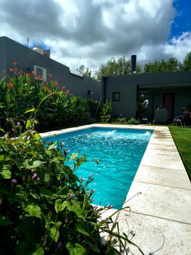 a swimming pool in the yard of a house at Funes Inn in Funes