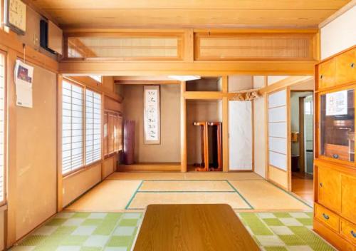 a room with a table in the middle of a room at Yuzawa Kodate - Vacation STAY 9495 in Yuzawa
