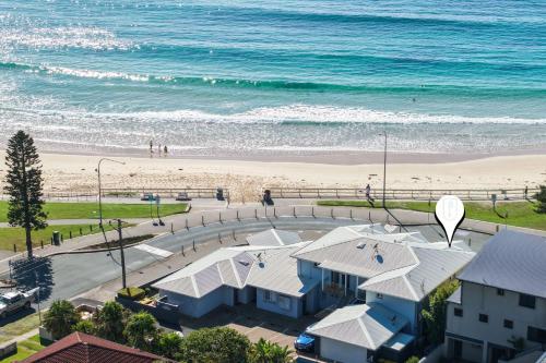 an aerial view of the beach and a beach at Mariners 5 in Mollymook