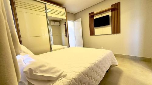 a hospital room with a bed and a mirror at Essenza Living in Formosa