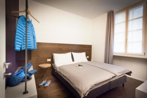 a bedroom with a large bed and a window at Casa Alla Lega in Arco